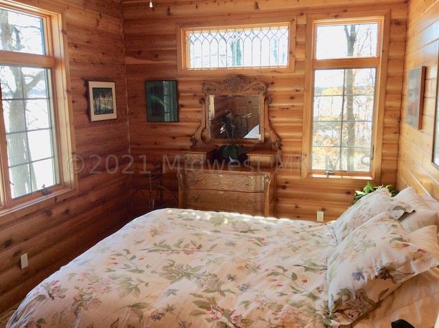 bedroom featuring multiple windows