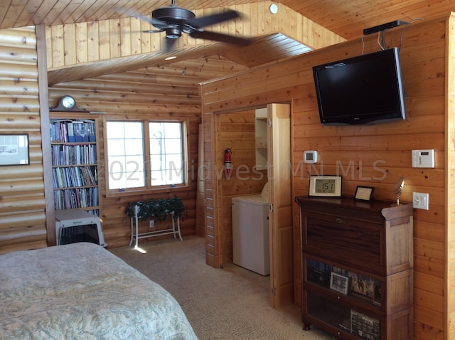 bedroom featuring wood ceiling, washer / clothes dryer, carpet flooring, and vaulted ceiling