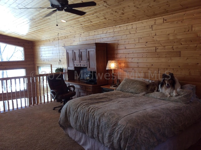 bedroom with ceiling fan, wooden ceiling, carpet flooring, vaulted ceiling, and wooden walls