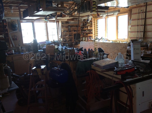 24557 Walden Rd, Rochert, MN 56578 - miscellaneous room featuring a workshop area and a wealth of natural light