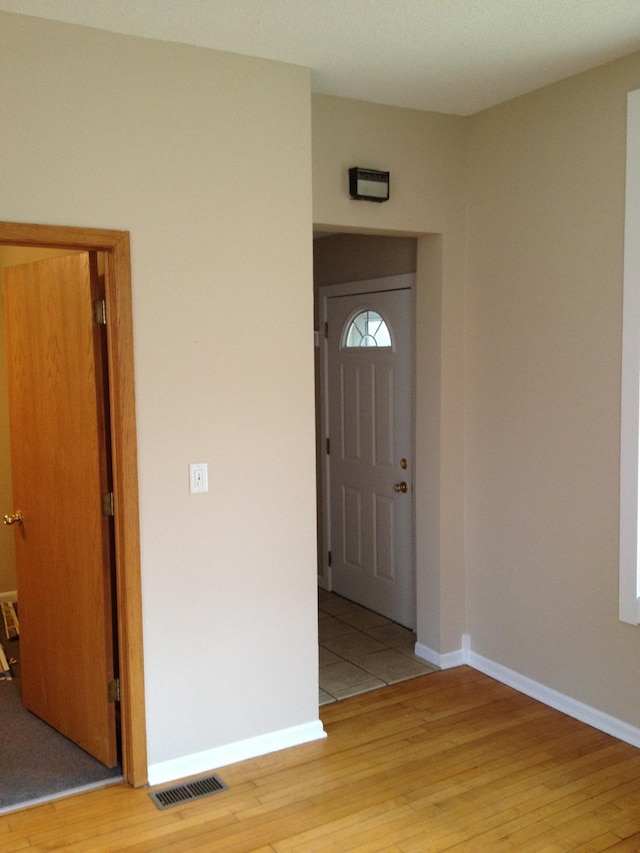 foyer entrance with light hardwood / wood-style floors