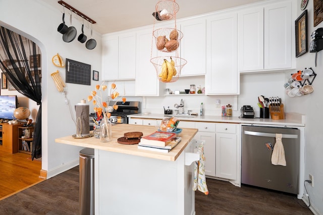 kitchen featuring white cabinets, dark wood-type flooring, appliances with stainless steel finishes, and sink