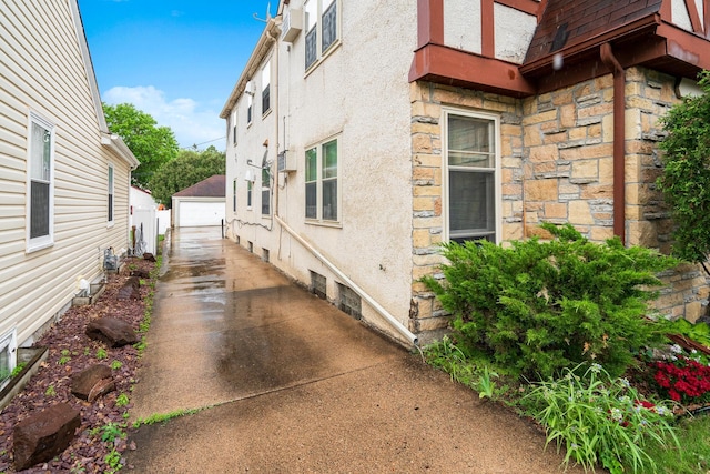 view of side of home featuring a garage