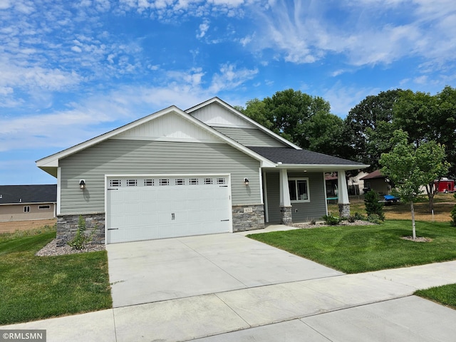 view of front of home featuring a front lawn and a garage