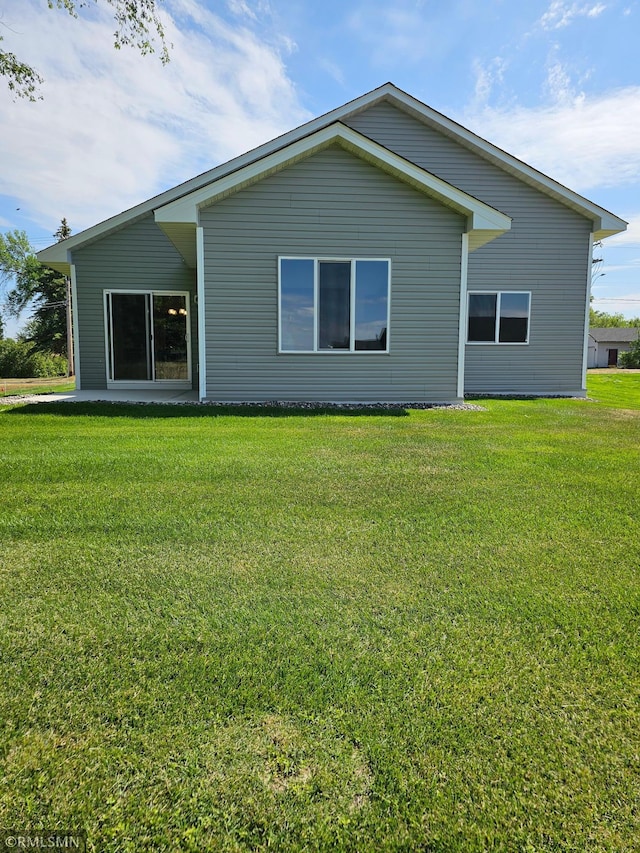 view of home's exterior featuring a yard