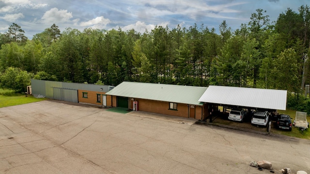 view of front of property featuring a carport