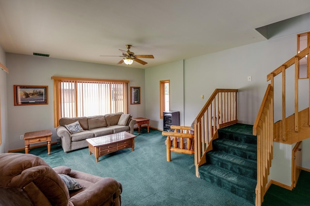 living room with dark carpet and ceiling fan