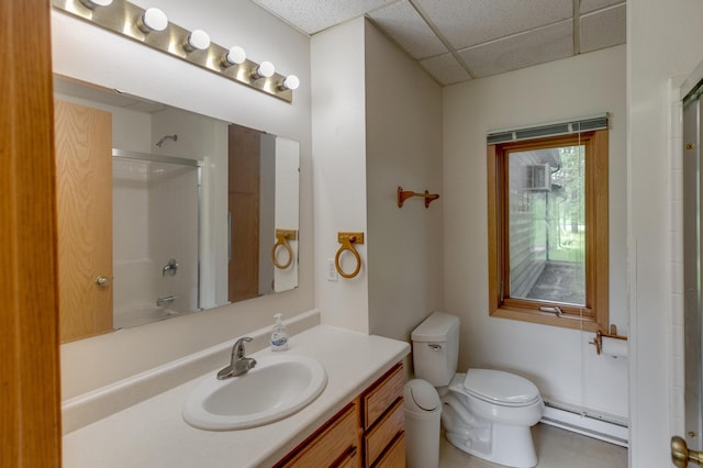 bathroom with a baseboard radiator, a paneled ceiling, toilet, and large vanity