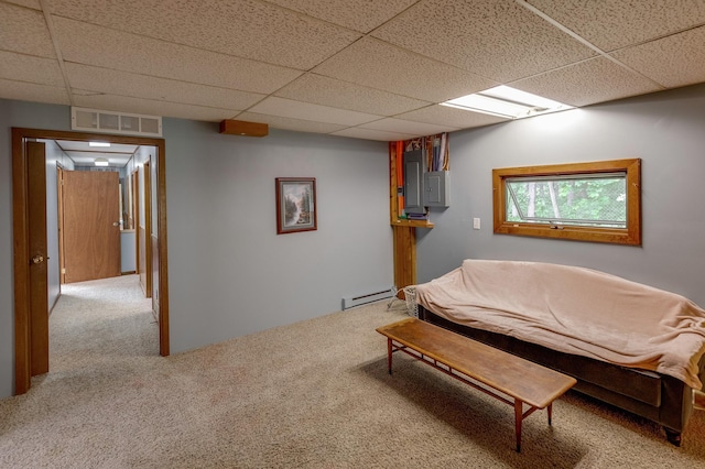 carpeted bedroom featuring a paneled ceiling and baseboard heating