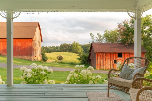 exterior space featuring a wooden deck and a storage unit