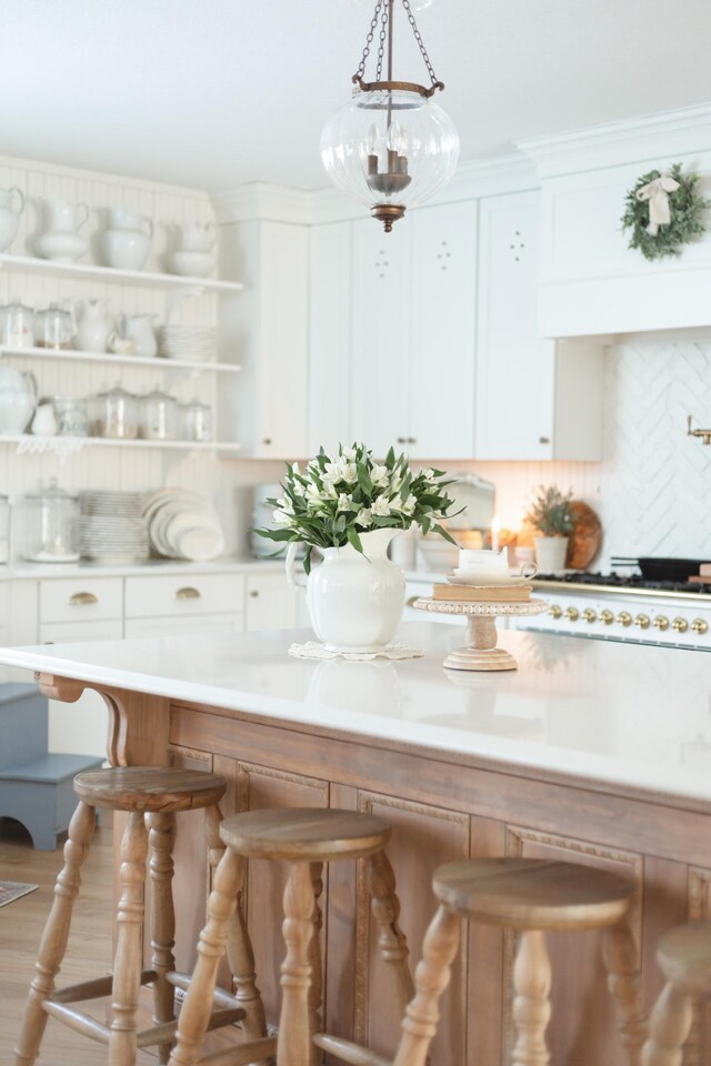 interior space with decorative backsplash and cooktop