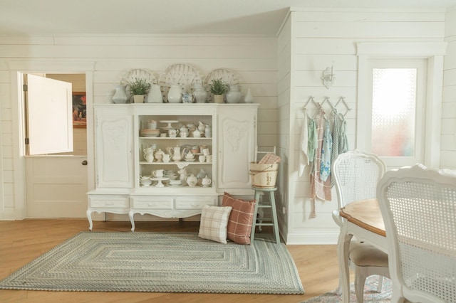 interior space featuring light hardwood / wood-style floors and white cabinetry