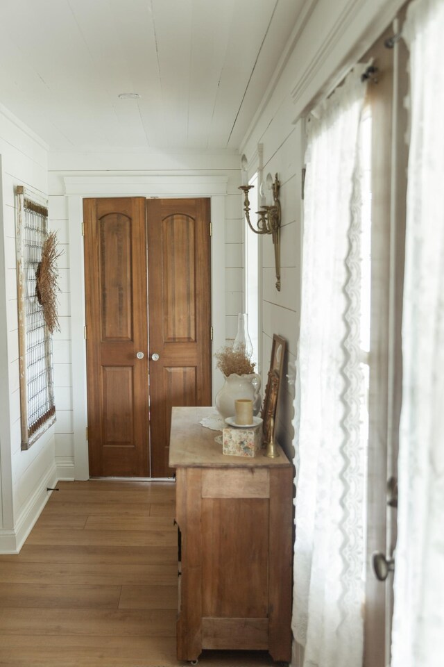 entryway with hardwood / wood-style floors