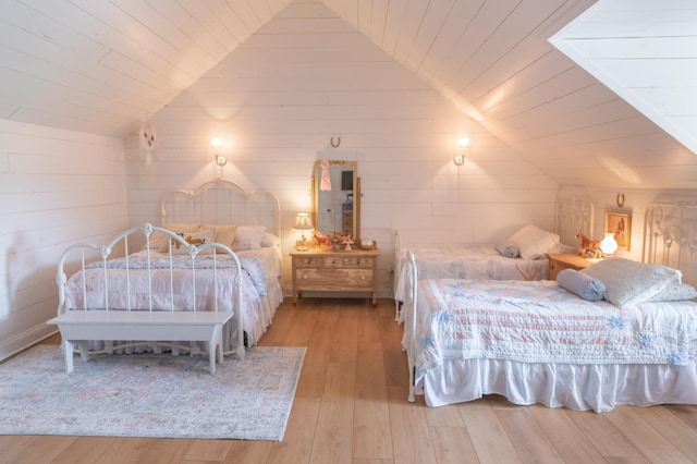 bedroom featuring lofted ceiling, wood ceiling, and light hardwood / wood-style floors