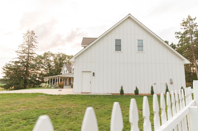 view of home's exterior with a lawn