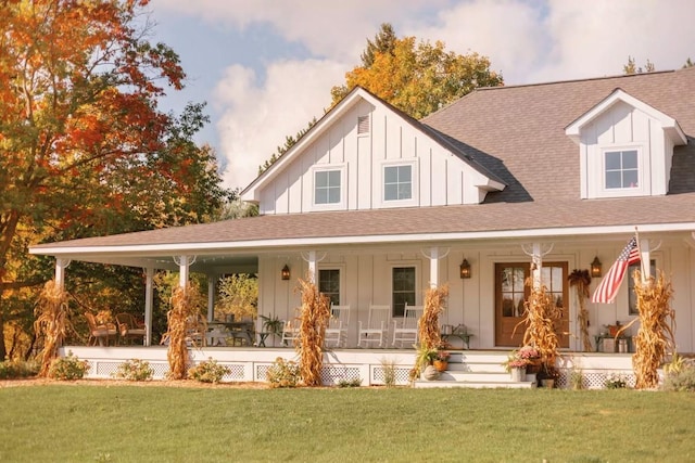 view of front facade with covered porch and a front yard