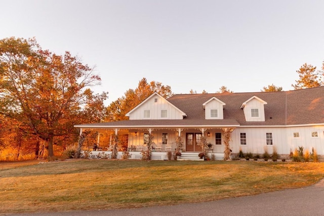 view of front of house featuring covered porch and a front lawn