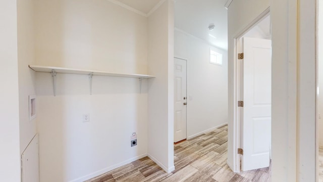 laundry room featuring light hardwood / wood-style floors, electric dryer hookup, and crown molding