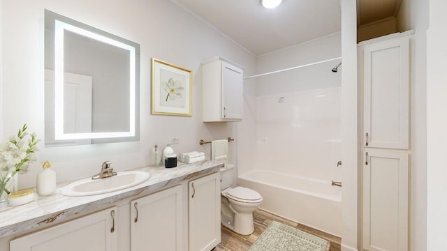 3611 85th St NW Unit 242, Oronoco Twp, MN 55960 - full bath featuring toilet, shower / bath combination, vanity, and wood finished floors