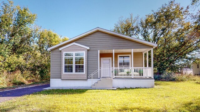 3611 85th St NW Unit 242, Oronoco Twp, MN 55960 - view of front of property with covered porch and a front yard