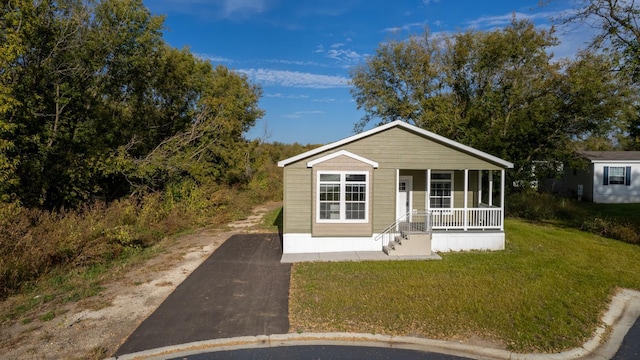 3611 85th St NW Unit 242, Oronoco Twp, MN 55960 - view of front facade with driveway, a porch, and a front lawn