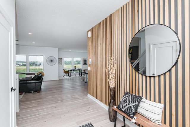 corridor with light hardwood / wood-style flooring