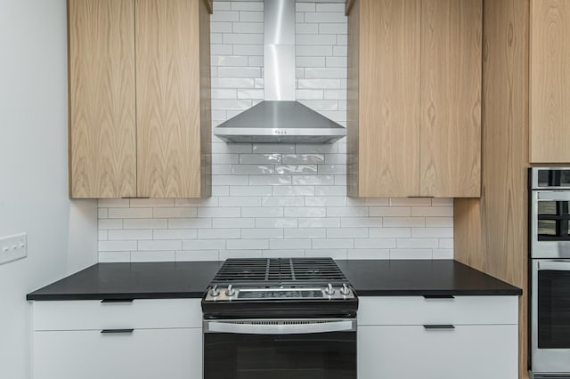2811 Wildflower Ln SW, Rochester, MN 55902 - kitchen featuring dark countertops, modern cabinets, wall chimney exhaust hood, decorative backsplash, and appliances with stainless steel finishes