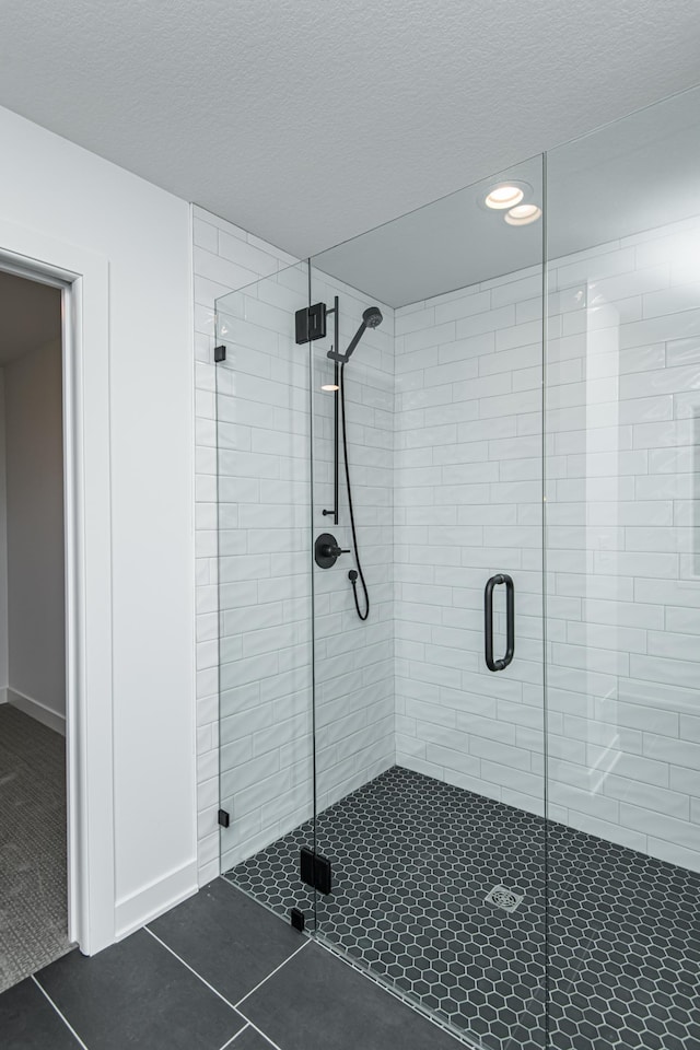 2811 Wildflower Ln SW, Rochester, MN 55902 - full bathroom with recessed lighting, a textured ceiling, tile patterned flooring, and a stall shower