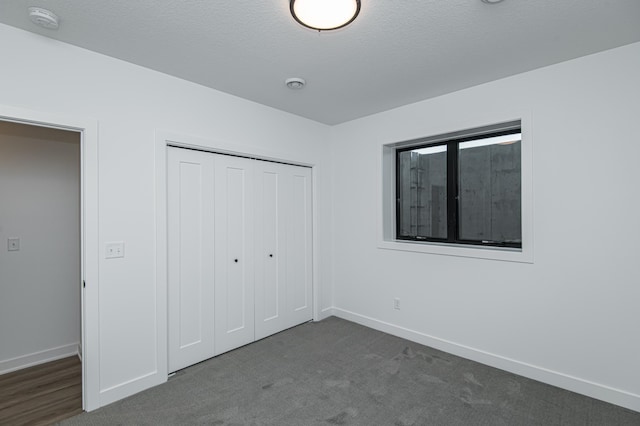 2811 Wildflower Ln SW, Rochester, MN 55902 - unfurnished bedroom with carpet floors, a closet, and baseboards