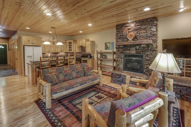 living room with a stone fireplace, wooden ceiling, and light hardwood / wood-style floors