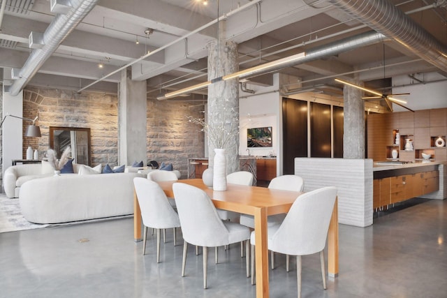 dining room with concrete floors