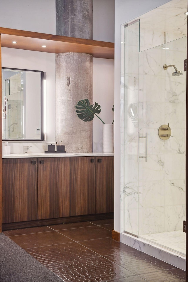 bathroom with vanity and a shower with shower door