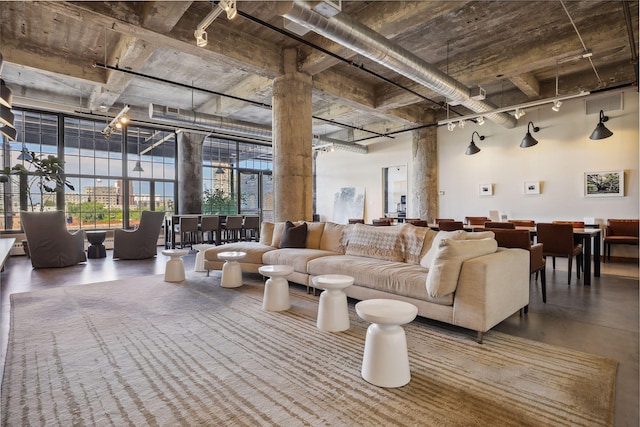 interior space with a towering ceiling and concrete floors