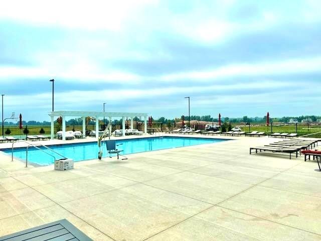 view of swimming pool with a patio