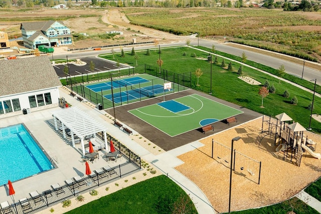 view of sport court featuring tennis court