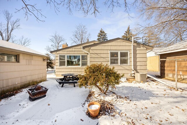 625 5th Ave S, Hopkins, MN 55343 - snow covered back of property with a chimney