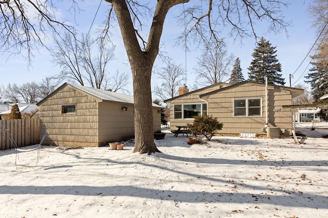 625 5th Ave S, Hopkins, MN 55343 - snow covered property featuring a chimney and a shed