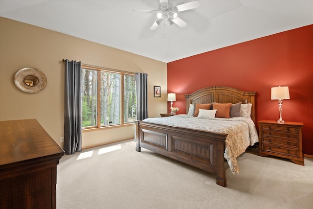 carpeted bedroom with lofted ceiling and ceiling fan