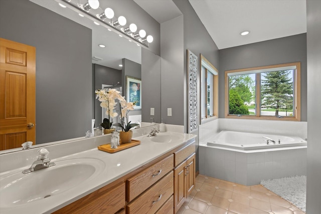 bathroom featuring a relaxing tiled bath, double vanity, and tile flooring