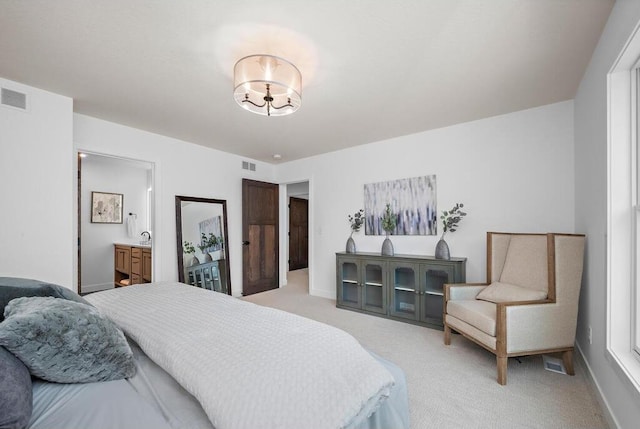 carpeted bedroom with ensuite bathroom