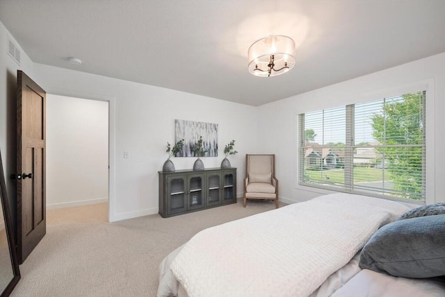 bedroom featuring light colored carpet