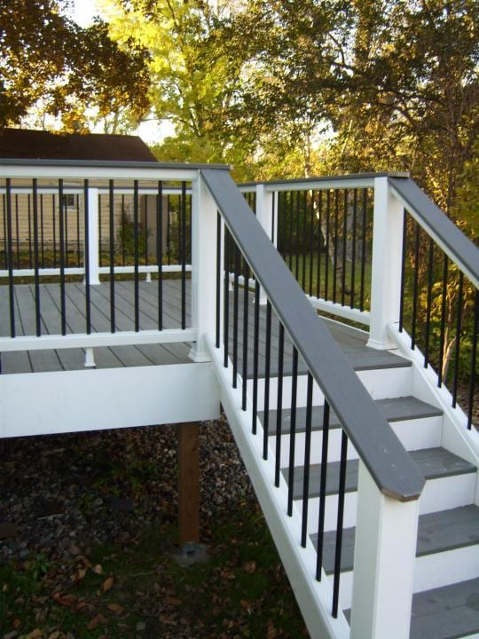 wooden deck featuring a sunroom