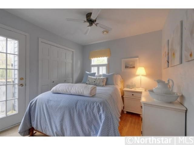 bedroom featuring a closet, ceiling fan, and light wood-type flooring