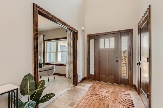 entryway with light hardwood / wood-style flooring