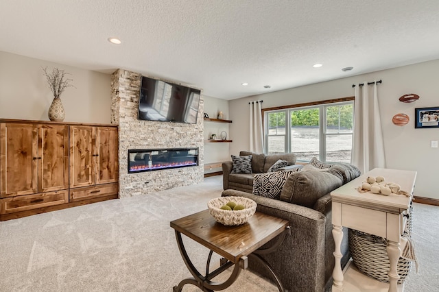 living room with light colored carpet, a textured ceiling, and a fireplace