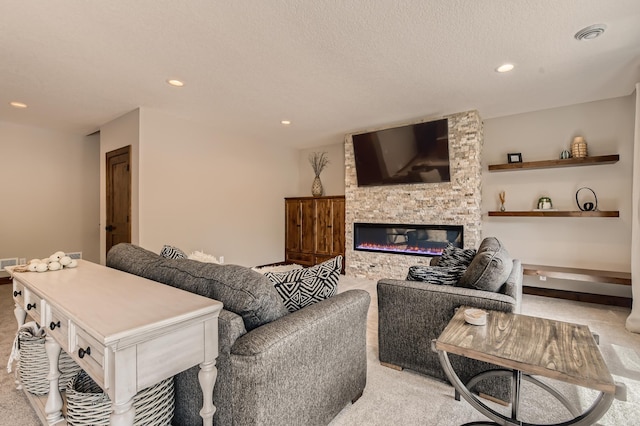 living room featuring a stone fireplace and light carpet