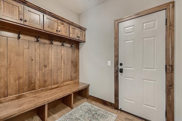 mudroom with light hardwood / wood-style flooring