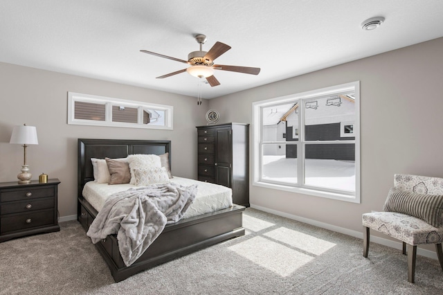 bedroom with ceiling fan and carpet floors