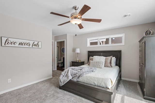 carpeted bedroom featuring ceiling fan and connected bathroom