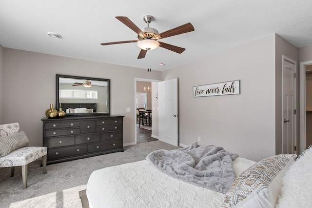 bedroom with ceiling fan and light colored carpet